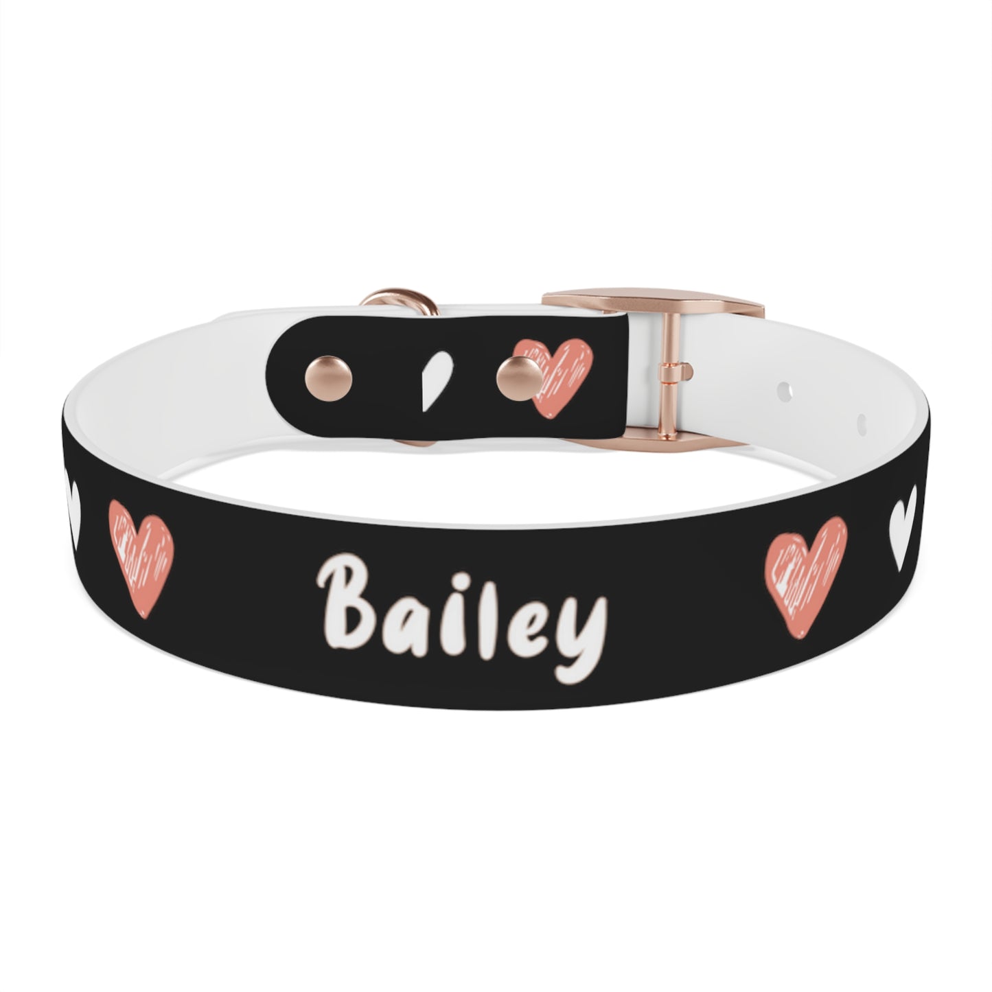 a dog collar with a beautiful hearts pattern design and the dog's name in the middle of the collar. The color of the dog collar is black