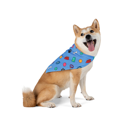 a cute dog wearing a bandana. The bandana has a beautiful pattern design with all things dog love. Bandana's Color is blue