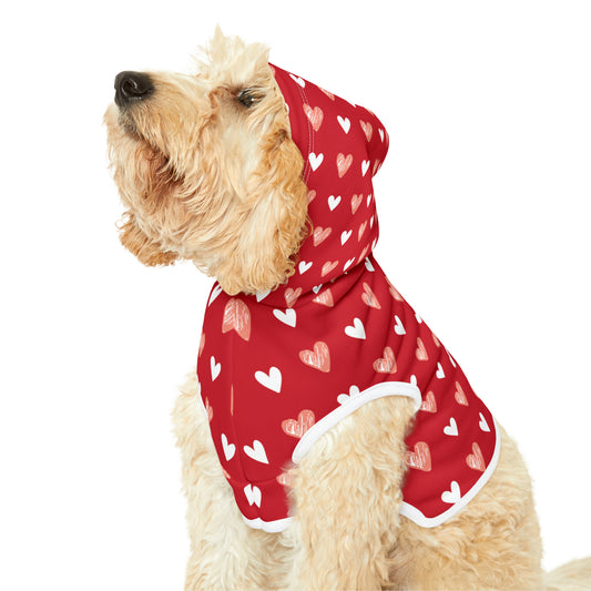 a cute dog wearing a pet hoodie with a beautiful hearts pattern design. Hoodie's Color is red
