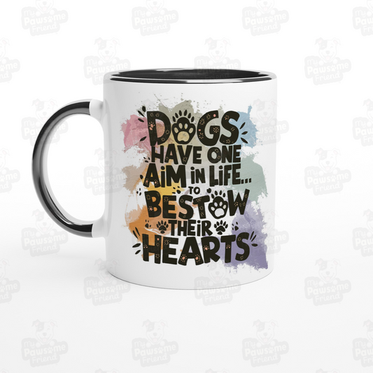 A ceramic coffee mug with a beautiful splash color design with the phrase: "Dogs Have One Aim in Life... To Bestow Their Hearts". The handle and inside of the coffee mug is black