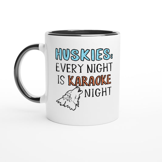 White ceramic coffee mug with the design: "HUSKIES: Every Night Is Karaoke Night.". The handle and interior are black