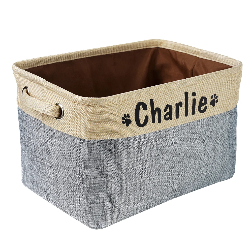 a personalized pet toy basket filled with dog toys. Color of the pet toy basket is grey