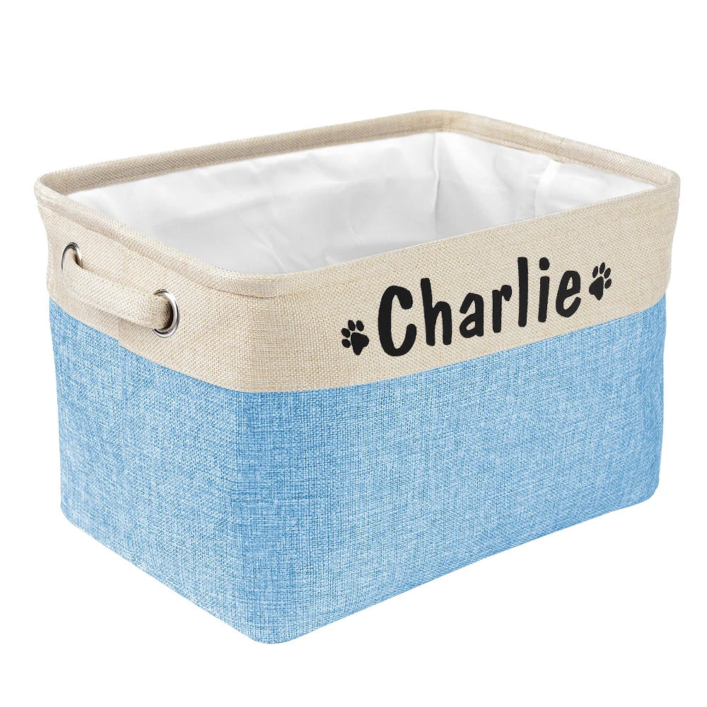 a personalized pet toy basket filled with dog toys. Color of the pet toy basket is blue