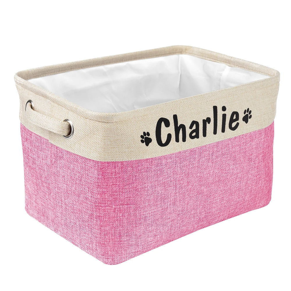 a personalized pet toy basket filled with dog toys. Color of the pet toy basket is pink